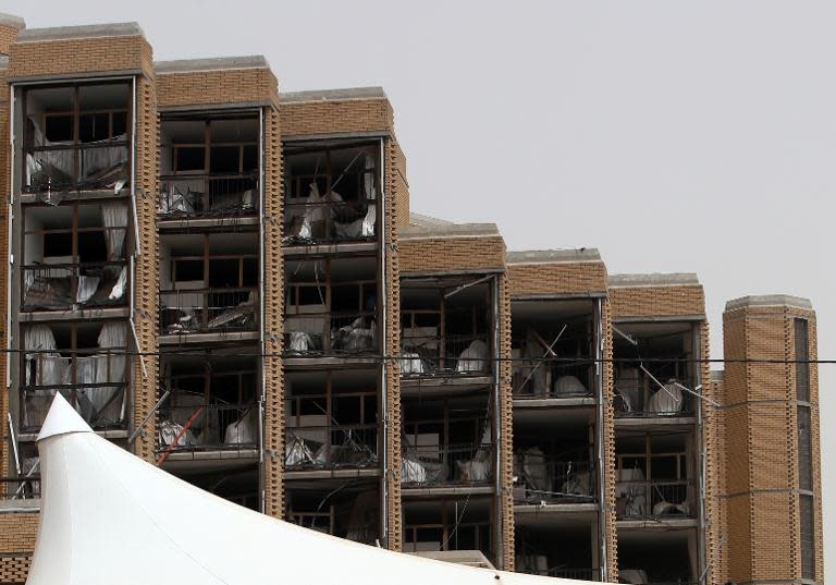 A general view shows the damage inflicted upon the Babylon hotel in Baghdad on May 29, 2015, after a car bomb ripped through the parking lot early in the morning