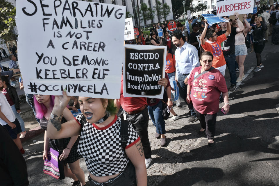 <p>Protesters carry signs and chant slogans to protest against Attorney General Jeff Sessions and the Trump administration’s policies in advance of his noontime address at the Criminal Justice Foundation’s annual luncheon meeting in Los Angeles in front of Federal Courthouse in Los Angeles on Tuesday, June 26, 2018. (Photo: Richard Vogel/AP) </p>