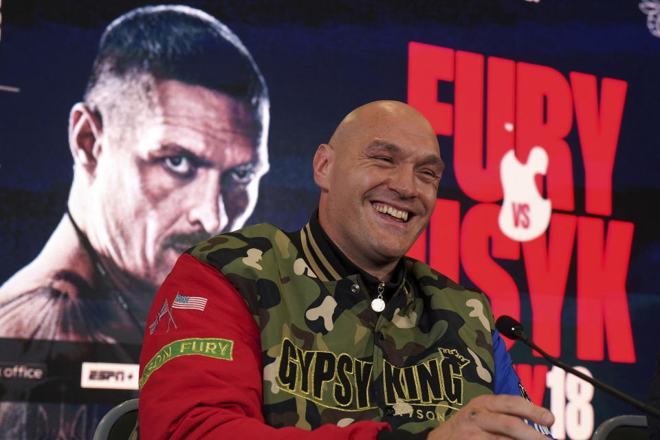 British professional boxer Tyson Fury smiles during a news conference at the The Mazuma Mobile Stadium, Morecambe, Wednesday, April 10, 2024. Tyson Fury says size will count for everything in his fight with Oleksandr Usyk to crown the first undisputed heavyweight champion since 2000. (Owen Humphreys/PA via AP)