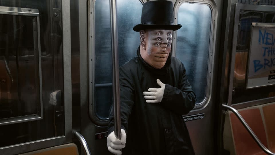 Vertiginous face paint illusion on the subway. - Seymour Licht