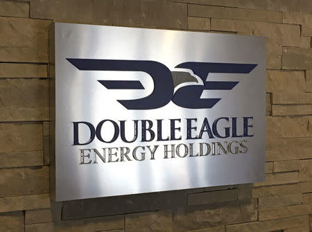 A Double Eagle Energy Holding sign hangs on the wall of their offices in Ft. Worth, Texas, U.S. February 18, 2016. REUTERS/Mike Stone