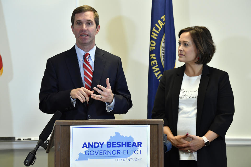 FILE - In this Nov. 14, 2019, file photo, Kentucky Gov.-elect Andy Beshear, left, with Lt. Gov.-elect Jacqueline Coleman, speaks with reporters following the concession of incumbent Gov. Matt Bevin in Frankfort, Ky. It's a role that seems scripted for Coleman, as an educator transitioning to the job as a "full partner" in a Democratic administration that vows to make public education a top priority. (AP Photo/Timothy D. Easley, File)