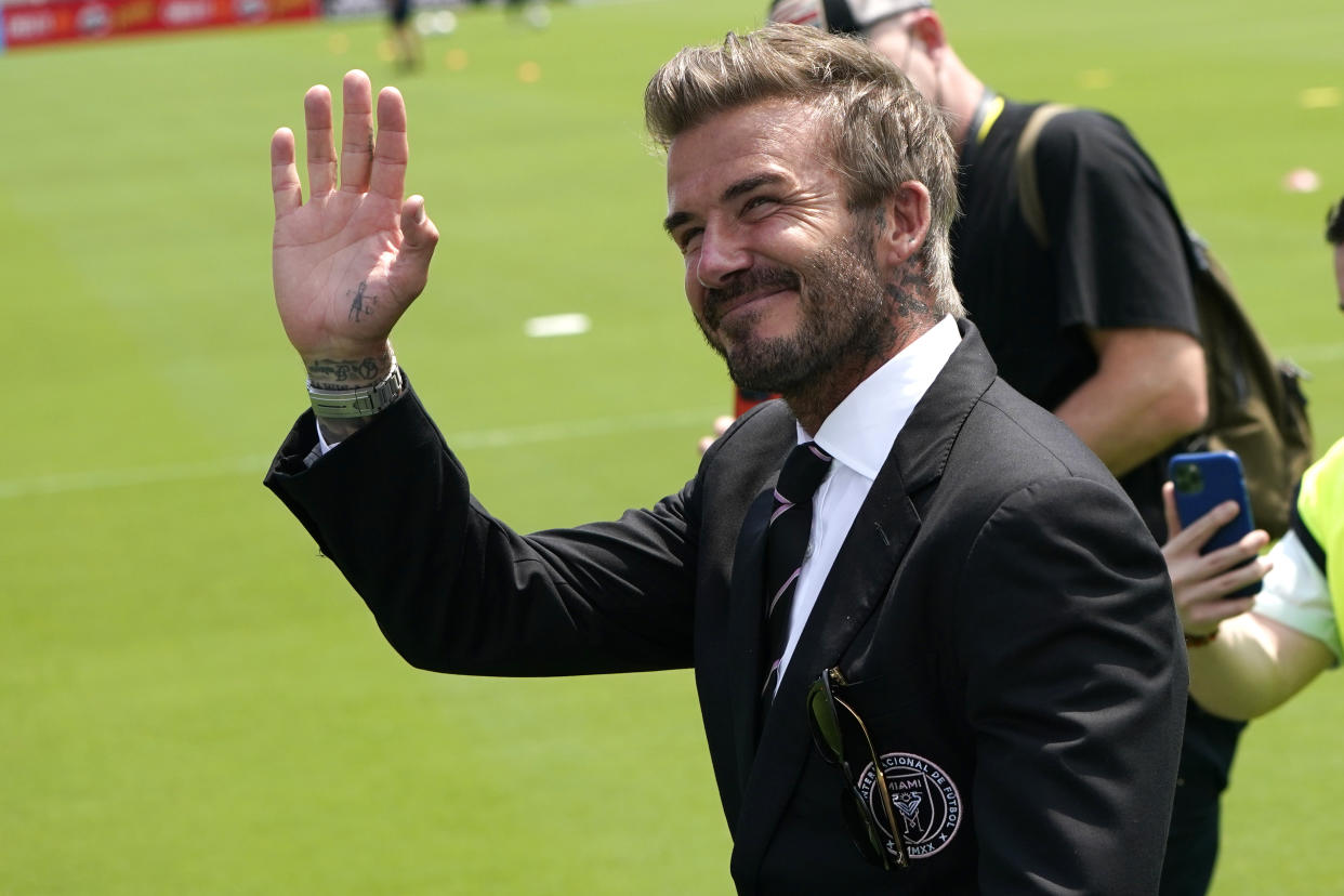 David Beckham, owner and president of soccer operations for Inter Miami, waves to fans before an MLS soccer match between Inter Miami, and LA Galaxy, Sunday, April 18, 2021, in Fort Lauderdale, Fla. (AP Photo/Lynne Sladky)