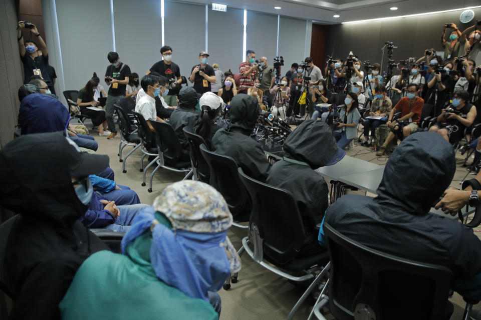 Relatives of 12 Hong Kong activists detained at sea by Chinese authorities attend a press conference in Hong Kong, Saturday, Sept. 12, 2020. They called for their family members to be returned to the territory, saying their legal rights were being violated. (AP Photo/Kin Cheung)