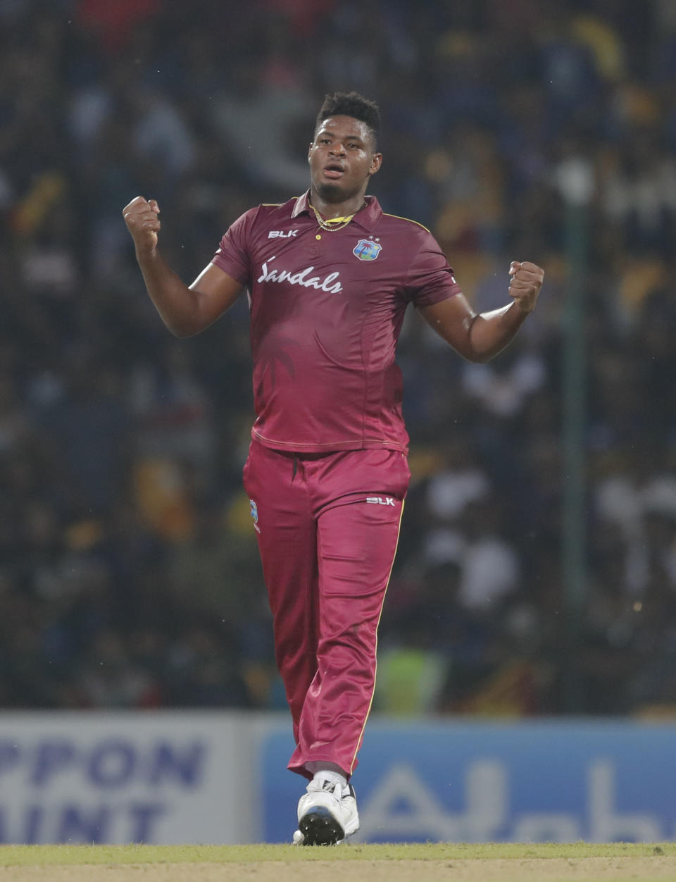 West Indies' bowler Oshane Thomas celebrates the dismissal of Sri Lanka's Dasun Shanaka during their first Twenty20 cricket match in Pallekele, Sri Lanka, Wednesday, March 4, 2020. (AP Photo/Eranga Jayawardena)