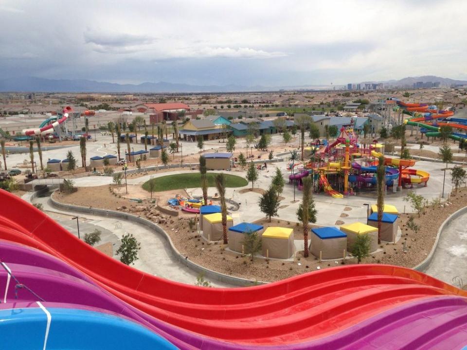 This undated photo supplied by Wet‘n’Wild Las Vegas shows a view of the water park before it opened Memorial Day weekend from atop the Desert Racers slides with the Las Vegas Strip in the distance. The water park is one of a number of new attractions opening around the country this year. (AP Photo/Wet‘n’Wild)