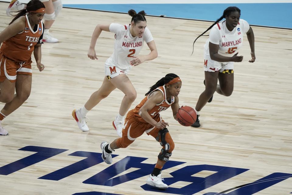 Texas's Kyra Lambert heads for the basket after a steal during the second half of an NCAA college basketball game against Maryland in the Sweet 16 round of the Women's NCAA tournament Sunday, March 28, 2021, at the Alamodome in San Antonio. (AP Photo/Morry Gash)