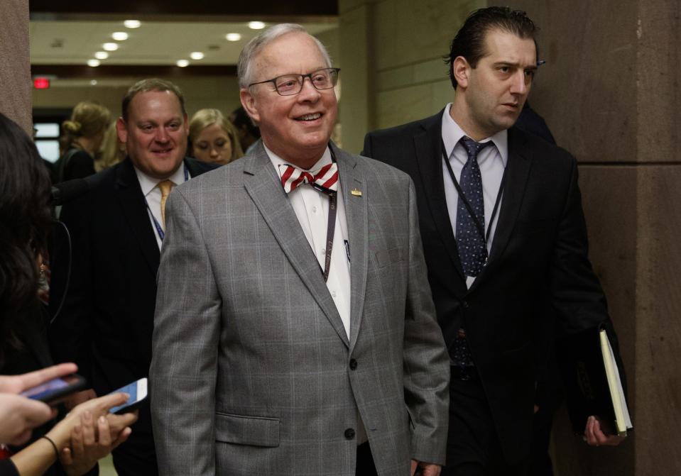 FILE - In this Nov. 15, 2018 file photo, U.S. Rep. Ron Wright, R-Texas, walks to a session during member-elect briefings and orientation on Capitol Hill in Washington. Wright, the Texas Republican who had battled health challenges over the past year including lung cancer treatment died Sunday, Feb. 7, 2021, more than two weeks after contracting COVID-19, his office said Monday, Feb. 8. He was 67. (AP Photo/Carolyn Kaster, File)