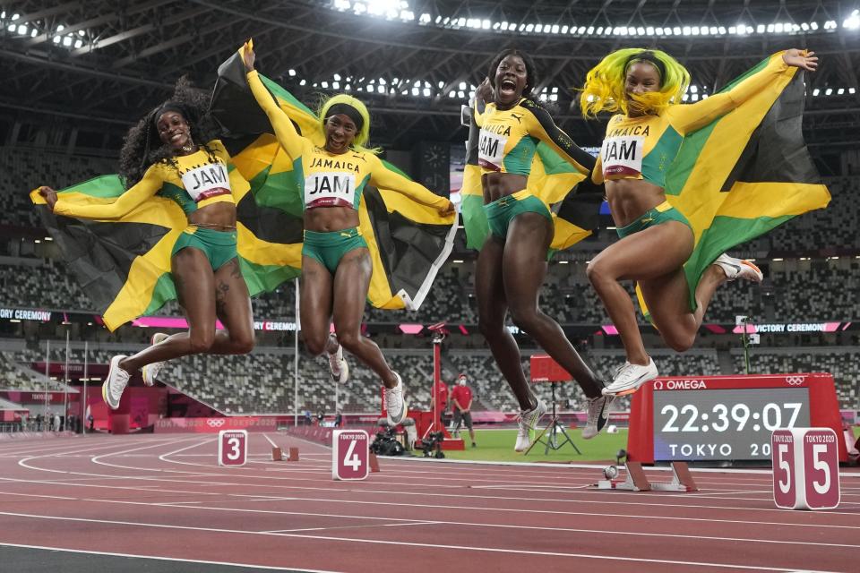 Team Jamaica celebrates after winning the final of the women's 4 x 100-meter relay at the 2020 Summer Olympics, Friday, Aug. 6, 2021, in Tokyo. (AP Photo/Petr David Josek)