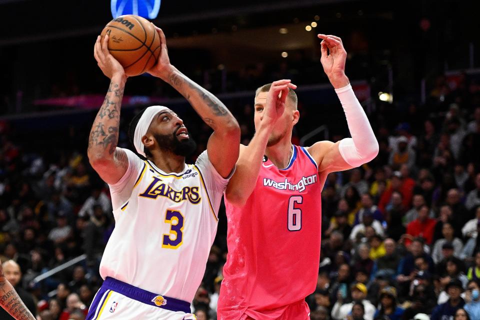 Anthony Davis shoots as Wizards center Kristaps Porzingis defends during the second half at Capital One Arena on Sunday. Davis scored 55 points.