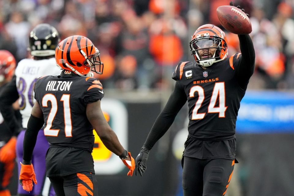 Safety Vonn Bell and cornerback Mike Hilton celebrate after forcing a turnover, one of four the Bengals forced against the Ravens last week.