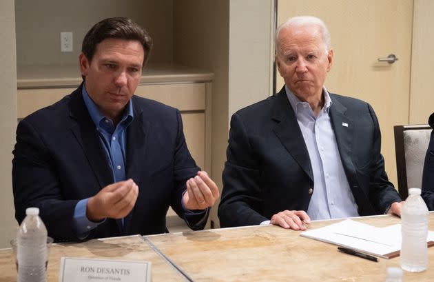 Florida Gov. Ron DeSantis (left) speaks about the collapse of the 12-story Champlain Towers South condo building in Miami alongside Biden on July 1. (Photo: SAUL LOEB via Getty Images)