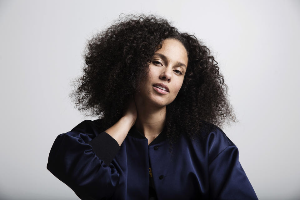 FILE - In this Nov. 2, 2016 file photo, Alicia Keys poses for a portrait in New York. Keys' memoir "More Myself" with be released on Tuesday, March 31. (Photo by Taylor Jewell/Invision/AP, File)