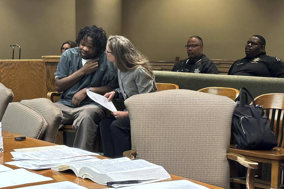 Cleotha Abston, left, speaks with his lawyer during his sentencing hearing for an April rape conviction on Friday, May 17, 2024, in Memphis, Tenn. Abston received 80 years in prison for kidnapping and raping a woman in September 2021, a year before he was charged with killing a Memphis school teacher. (AP Photo/Adrian Sainz)
