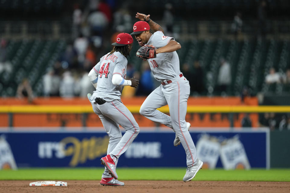 Cincinnati Reds' Elly De La Cruz (44) and Will Benson (30) celebrate after a baseball game against the Detroit Tigers, Tuesday, Sept. 12, 2023, in Detroit. (AP Photo/Paul Sancya)