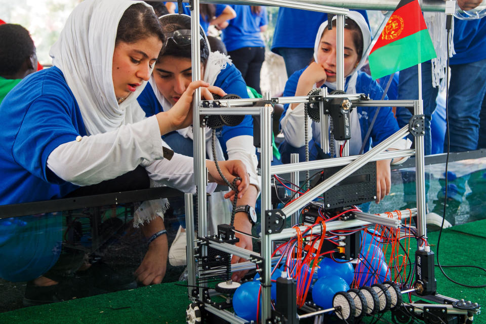 Members of the Afghan all-girls robotics team with their robot in the practice area at the FIRST Global Challenge in Washington in July 2017. (Paul J. Richards / AFP via Getty Images file)