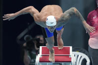 Caeleb Dressel of the United States starts in his heat of the men's 100-meter butterfly at the 2020 Summer Olympics, Thursday, July 29, 2021, in Tokyo, Japan. (AP Photo/Matthias Schrader)