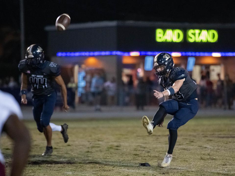 Cade Lombardo (33) kicks off during the Navarre vs Gulf Breeze football game at Gulf Breeze High School on Friday, Oct. 28, 2022.