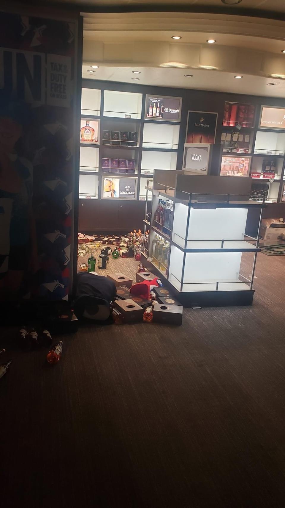 Store with bottles spilled about the floor.