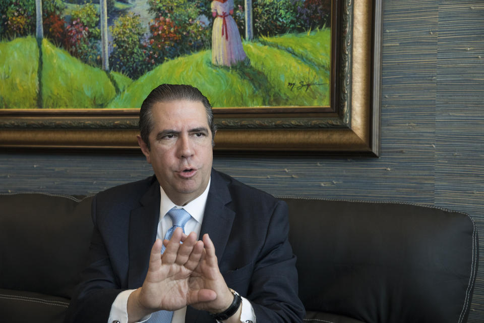 The Minister of Tourism of The Dominican Republic Francisco Javier García speaks during an interview regarding concerns over the recent deaths of tourists on Dominican soil, at his office in the Ministry of Tourism building in Santo Domingo, Dominican Republic, Friday, June 21, 2019. According to García the deaths of eight American tourists in the Dominican Republic this year are not part of a mysterious cluster but rather a medically and statistically normal phenomenon that has been irresponsibly lumped together by the U.S. media. (AP Photo/Tatiana Fernandez)