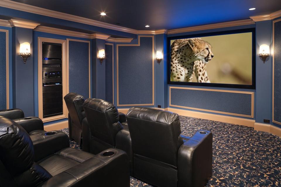 black leather chairs adorn a beautiful home theatre