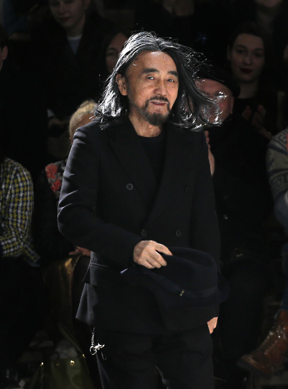 Japanese fashion designer Yohji Yamamoto accepts applause after his Fall/Winter 2013-2014 ready to wear collection, presented in Paris, Friday, March 1, 2013. (AP Photo/Christophe Ena)