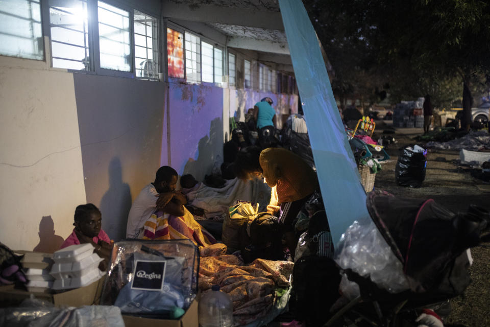 Migrants trying to reach the U.S., many from Haiti, camp out in Ciudad Acuna, Mexico, at dawn Thursday, Sept. 23, 2021, across the Rio Grande river, the natural border with Del Rio, Texas. (AP Photo/Felix Marquez)