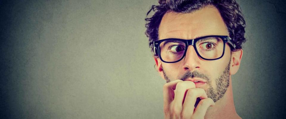 Anxious stressed young man looking away