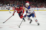 Edmonton Oilers center Connor McDavid (97) skates with the puck past Washington Capitals center Dylan Strome in the second period of an NHL hockey game, Monday, Nov. 7, 2022, in Washington. (AP Photo/Patrick Semansky)