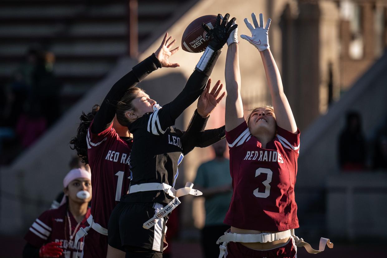 Fitchburg's Gianexis Santiago, left, and Shamarie Rodriquez break up a pass intended for Leominster's Hailey Jimenez on Thursday at Crocker Field.