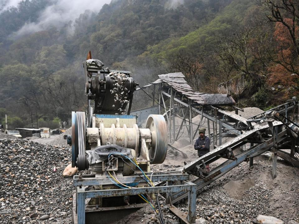 This picture taken on 4 April 2023 shows a road construction site in the Tawang district of India’s Arunachal Pradesh state. - Freshly laid roads, bridges, upgraded military camps, and new civilian infrastructure dot the winding high Himalayan route to the Indian frontier village of Zemithang -- which China renamed last month to press its claim to the area. It is in the far northeastern Indian state of Arunachal Pradesh, almost all of which Beijing insists falls under its sovereignty as 'South Tibet’ (AFP via Getty Images)