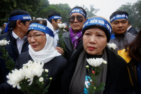 People take part in an anti-China protest to mark the 43th anniversary of the China's occupation of the Paracel Islands in the South China Sea in Hanoi, Vietnam January 19, 2017. REUTERS/Kham