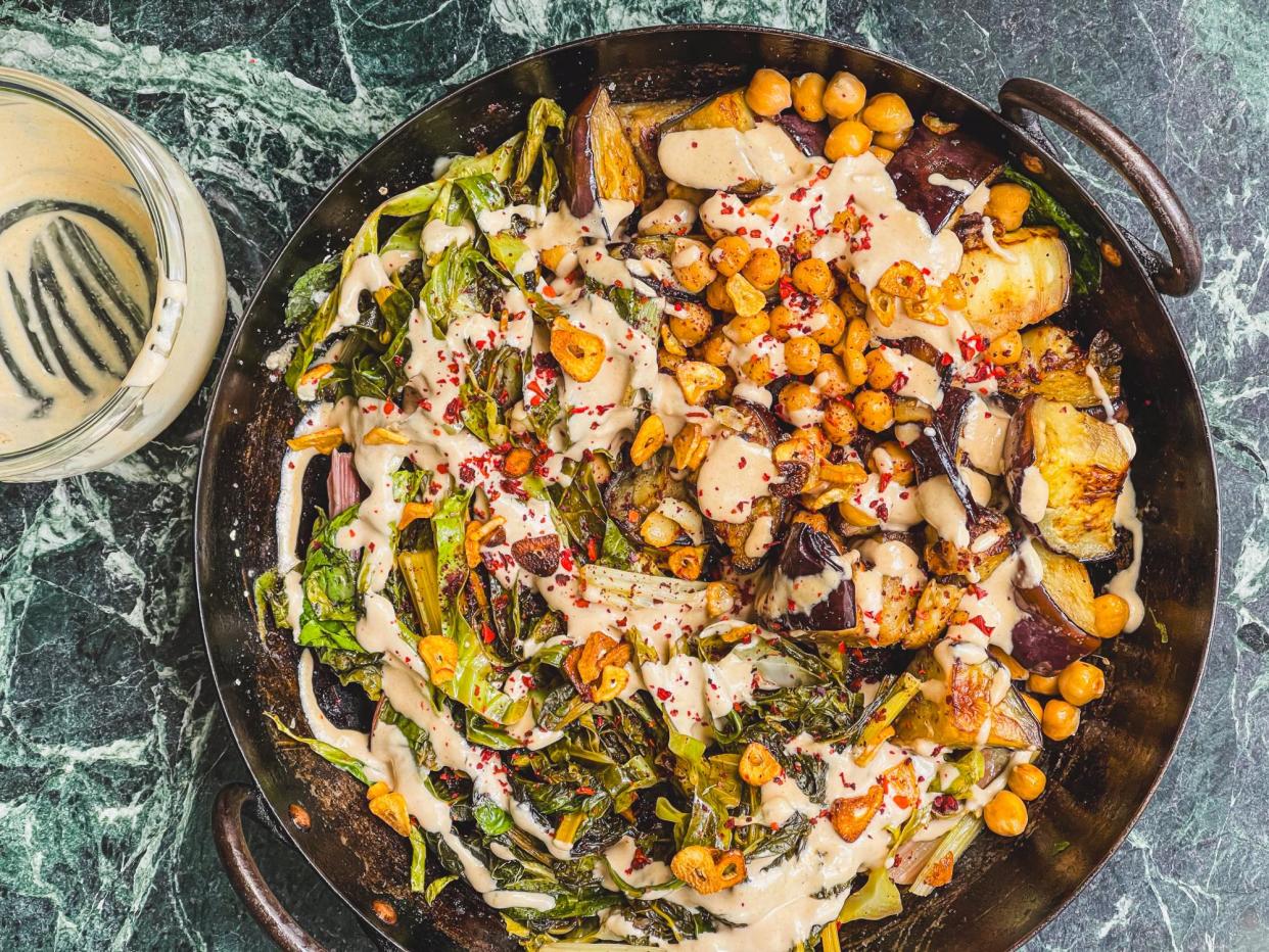 <span>Tom Hunt's tahinia jar sauce with braised chard, aubergine and chickpeas.</span><span>Photograph: Tom Hunt/The Guardian</span>