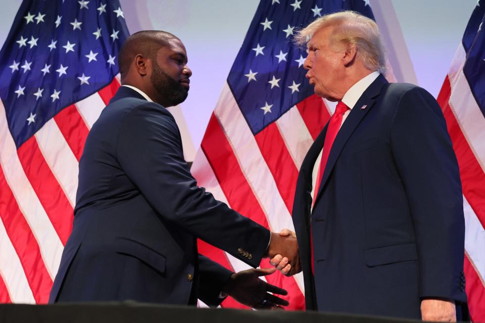 Byron Donalds shakes Donald Trump's hand