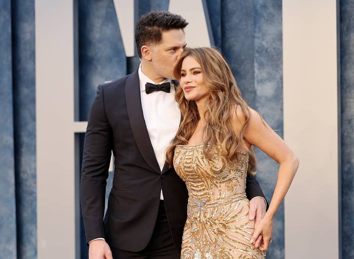 Joe Mangianello kisses Sofia Vergara's head while on the red carpet