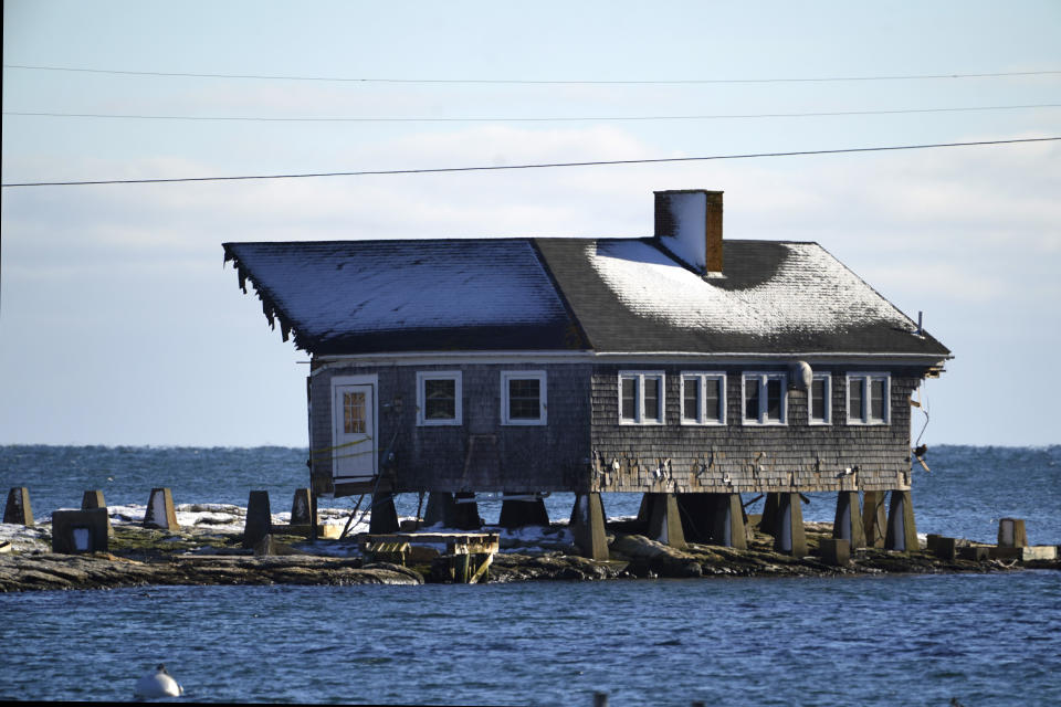 FILE - A small portion of the community cookhouse remains standing on Malden Island in Georgetown, Maine, Tuesday, Jan. 30, 2024. The building is one of numerous structures damaged in a Jan. 10, 2024 storm. (AP Photo/Robert F. Bukaty)