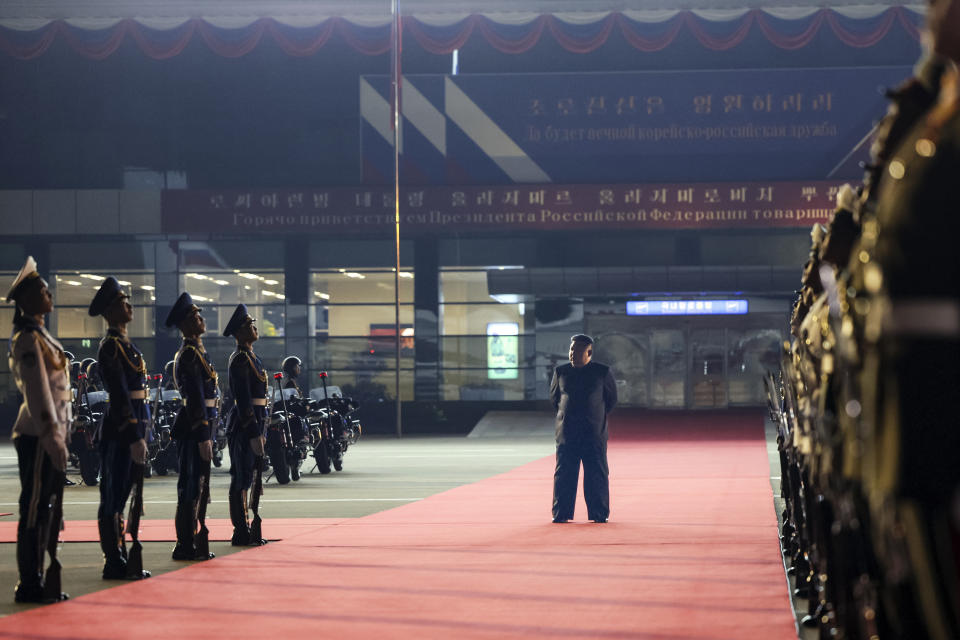 North Korea's leader Kim Jong Un stands waiting to meet Russian President Vladimir Putin at the Pyongyang Sunan International Airport outside Pyongyang, North Korea, on Tuesday, June 18, 2024. (Gavriil Grigorov, Sputnik, Kremlin Pool Photo via AP)