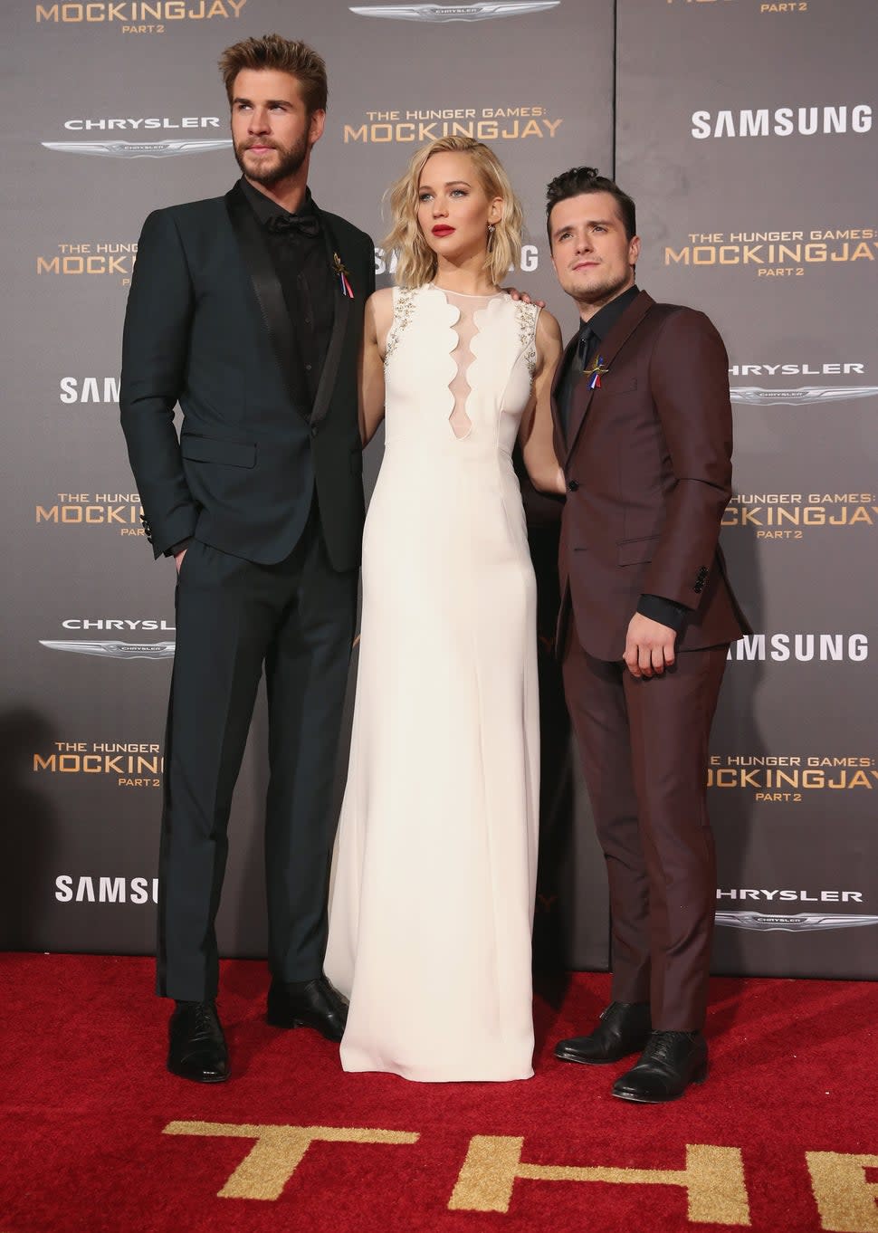Liam Hemsworth, Jennifer Lawrence and Josh Hutcherson attend premiere of Lionsgate's The Hunger Games: Mockingjay - Part 2 at Microsoft Theater on Nov.16, 2015 in Los Angeles, California.