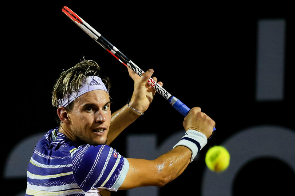 Dominic Thiem hits a backhand return.