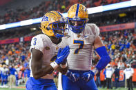 Pittsburgh wide receiver Jordan Addison, left, celebrates with tight end Lucas Krull after scoring a touchdown against Syracuse during the second half of an NCAA college football game in Syracuse, N.Y., Saturday, Nov. 27, 2021. (AP Photo/Adrian Kraus)