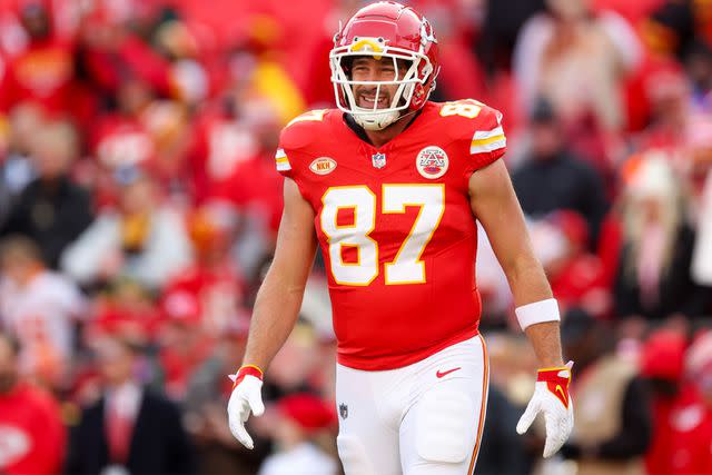 <p>Jamie Squire/Getty</p> Travis Kelce warming up in Dec. 10, 2023