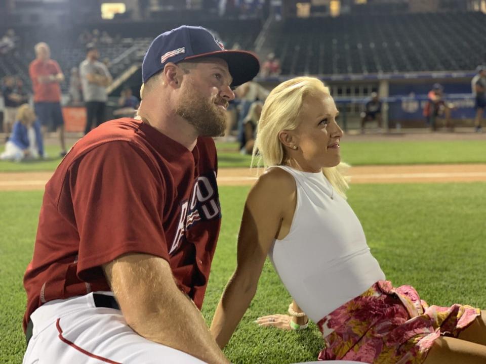 Aaron and Kendyl Barrett watch fireworks on July 4 after his final game as a professional baseball pitcher.