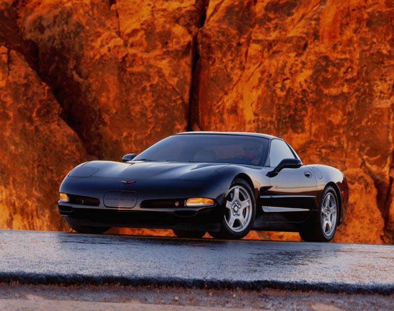 A promotional image of a C5 Corvette, viewed from the front quarter angle.