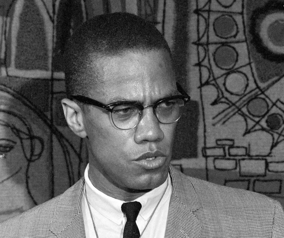 FILE - This March 12, 1964 file photo, Malcolm X addresses reporters at the Hotel Park-Sheraton in New York. Malcolm X’s family and estate said rapper-singer Nicki Minaj’s use of the black nationalist with a rifle in his hands, juxtaposed with a racial slur, for her single artwork is disrespectful and offensive. In an exclusive statement to The Associated Press on Friday, Feb. 14, 2014, Malcolm X’s daughter, Ilyasah Shabazz, said Minaj’s use of the picture is “in no way is endorsed by my family.” (AP Photo, File)