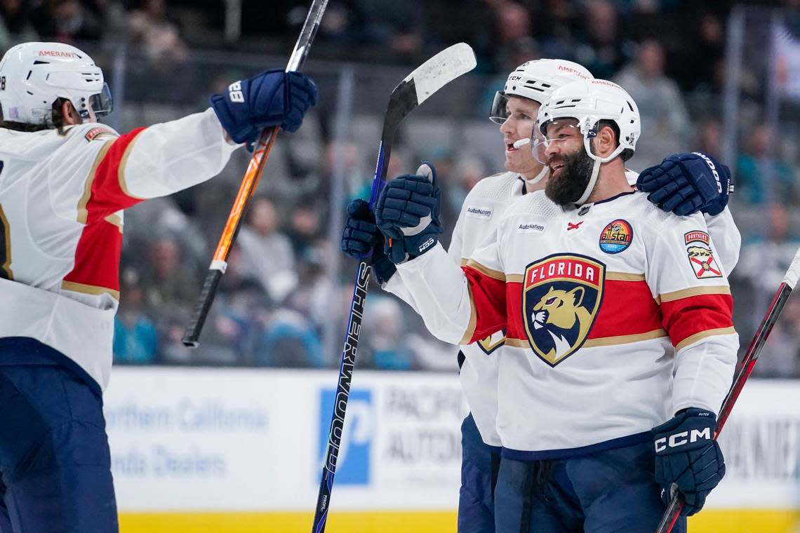 Florida Panthers defenseman Radko Gudas, right, celebrates with teammates after scoring against the San Jose Sharks during the second period of an NHL hockey game in San Jose, Calif., Thursday, Nov. 3, 2022. (AP Photo/Godofredo A. VÃ(degrees)squez)