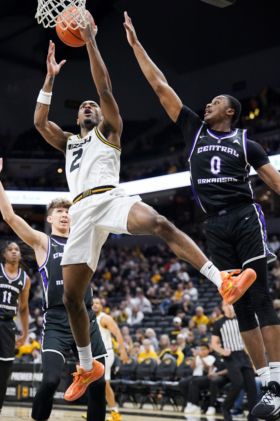 Dec 30, 2023; Columbia, Missouri, USA; Missouri Tigers guard Tamar Bates (2) shoots as Central Arkansas Bears forward UbongAbasi Etim (0) defends during the first half at Mizzou Arena. Mandatory Credit: Denny Medley-USA TODAY Sports