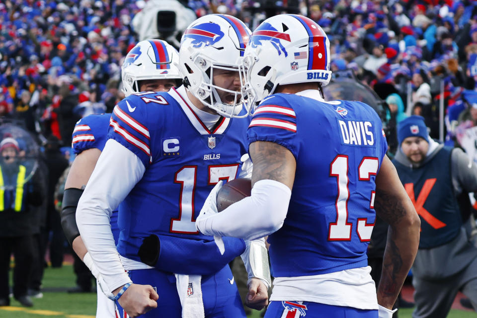 Buffalo Bills wide receiver Gabe Davis (13), right, is congratulated by quarterback Josh Allen after his touchdown catch during the second half of an NFL wild-card playoff football game against the Miami Dolphins, Sunday, Jan. 15, 2023, in Orchard Park, N.Y. (AP Photo/Jeffrey T. Barnes)