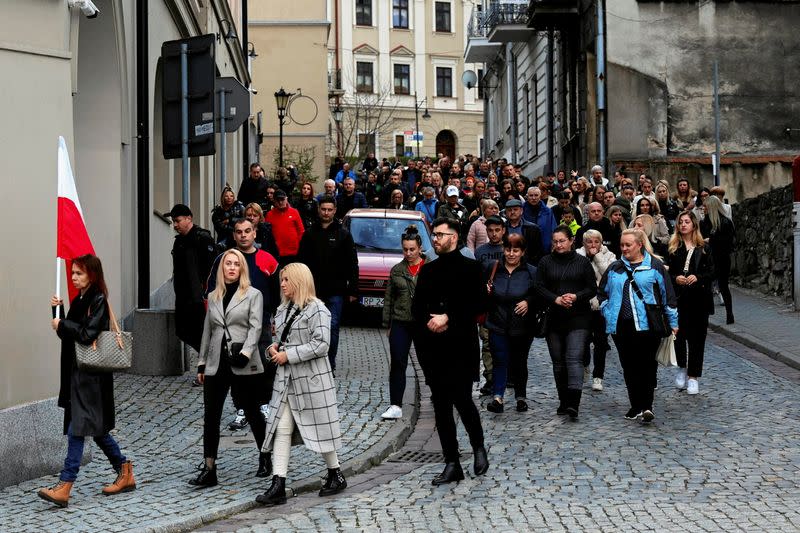 Mourners gather to hold a vigil for the Polish aid worker Damian Sobol who was killed by the Israeli army in Gaza, in Przemysl