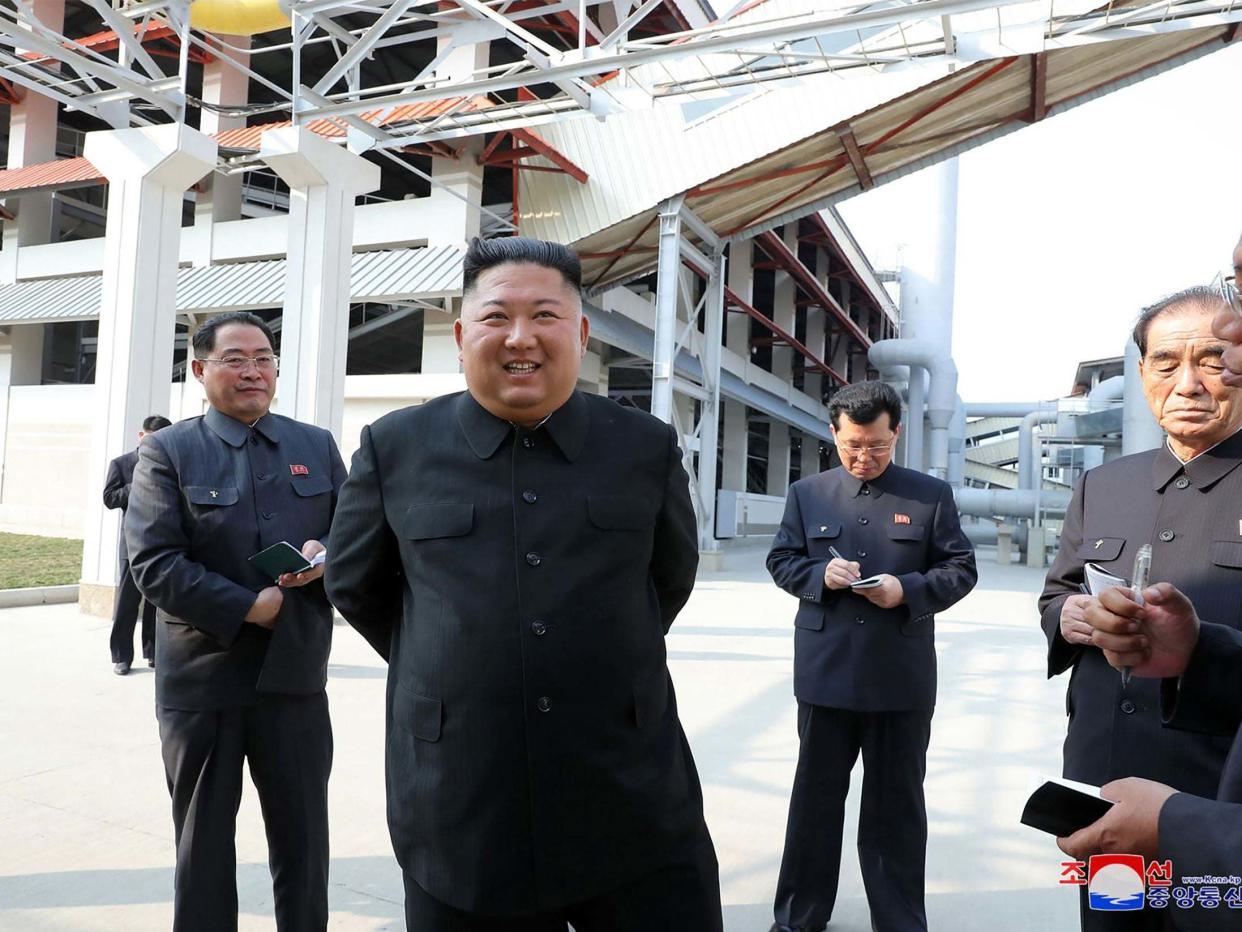 This picture, released from North Korea's official Korean Central News Agency (KCNA), shows North Korean leader Kim Jong Un visiting the completed Suchon phosphate fertilizer factory in South Pyongan Province: KCNA VIA KNS/AFP via Getty Image