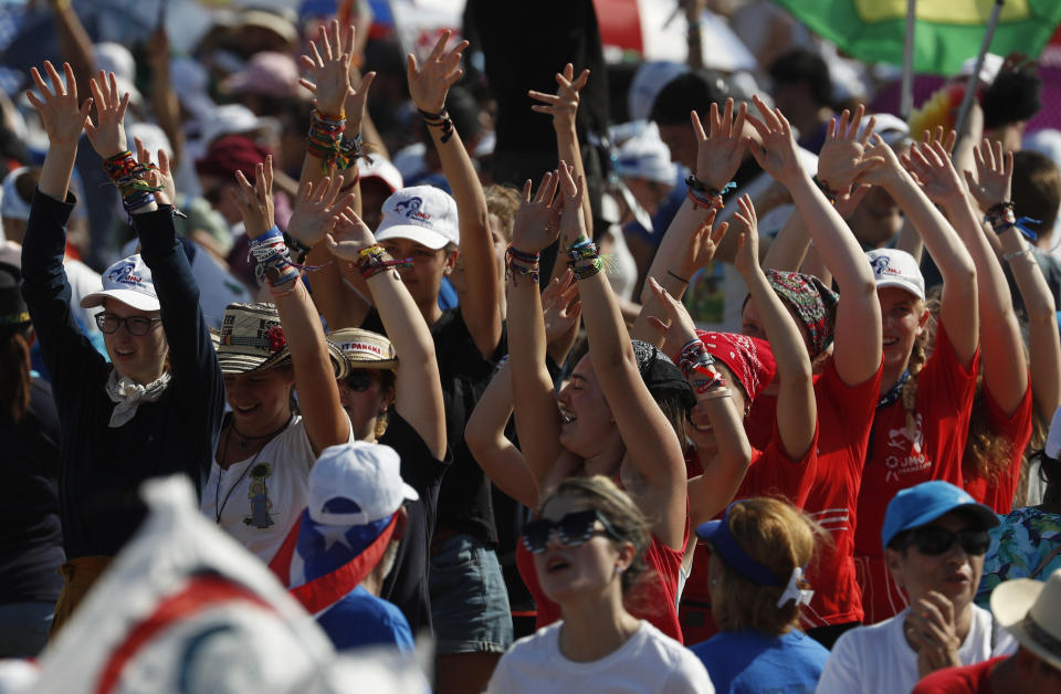 Pilgrims do a synchronized dance to music after Mass with Pope Francis at metro park Campo San Juan Pablo II in Panama City, Sunday, Jan. 27, 2019. Francis is wrapping up his trip to Central America with a final World Youth Day Mass and a visit to a church-run home for people living with AIDS. (AP Photo/Rebecca Blackwell)